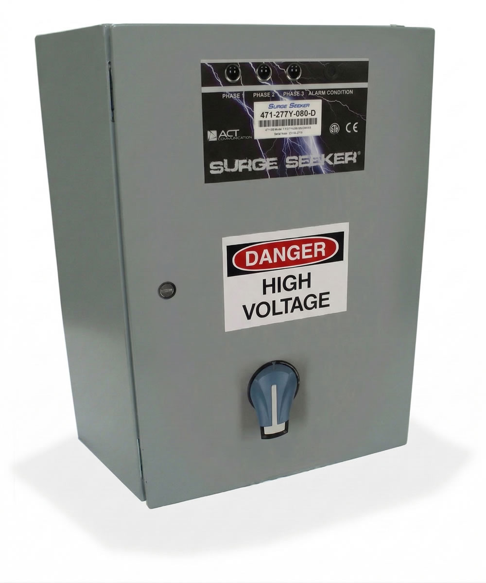 Gray electrical box labeled Danger High Voltage; Surge Seeker brand, wall-mounted unit with a control knob.