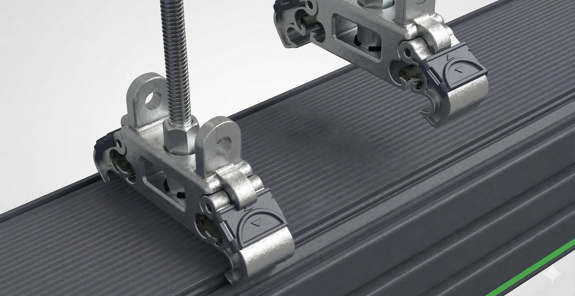 Close-up of metal clamps on a grooved surface for industrial equipment assembly.