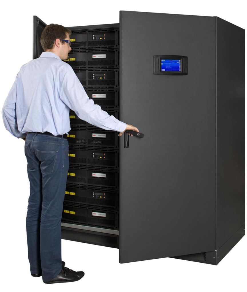 Person accessing large data server cabinet for maintenance.