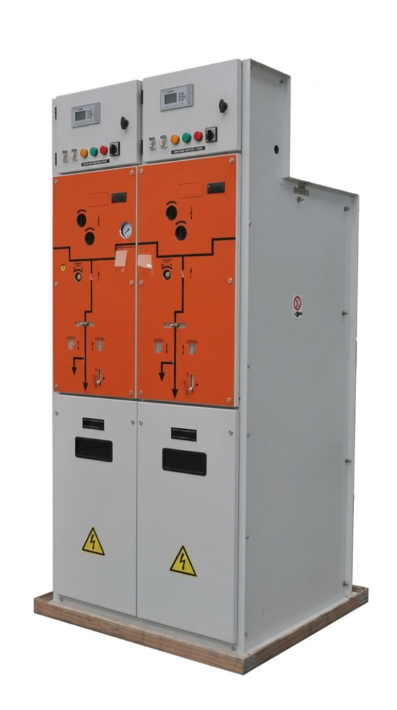 Electrical switchgear unit with orange control panels, meters, and safety warnings.